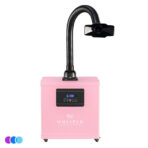 A pink Whisper salon source capture system with a flexible black hose and vent. The front panel has a digital display, buttons, and the brand name "Whisper." The unit sits on small wheels and has blue, purple, and light blue color dots in the corner. Read more at Aerovex Systems (aerovexsystems.com)