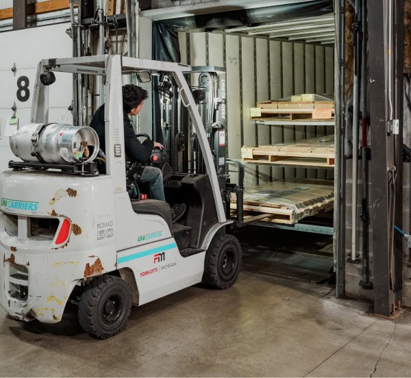 forklift driver unloading shipment