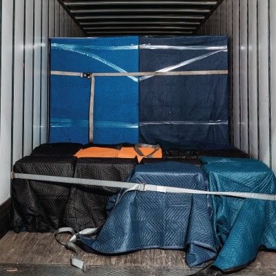 Cargo containers and luggage secured in an airport storage unit.