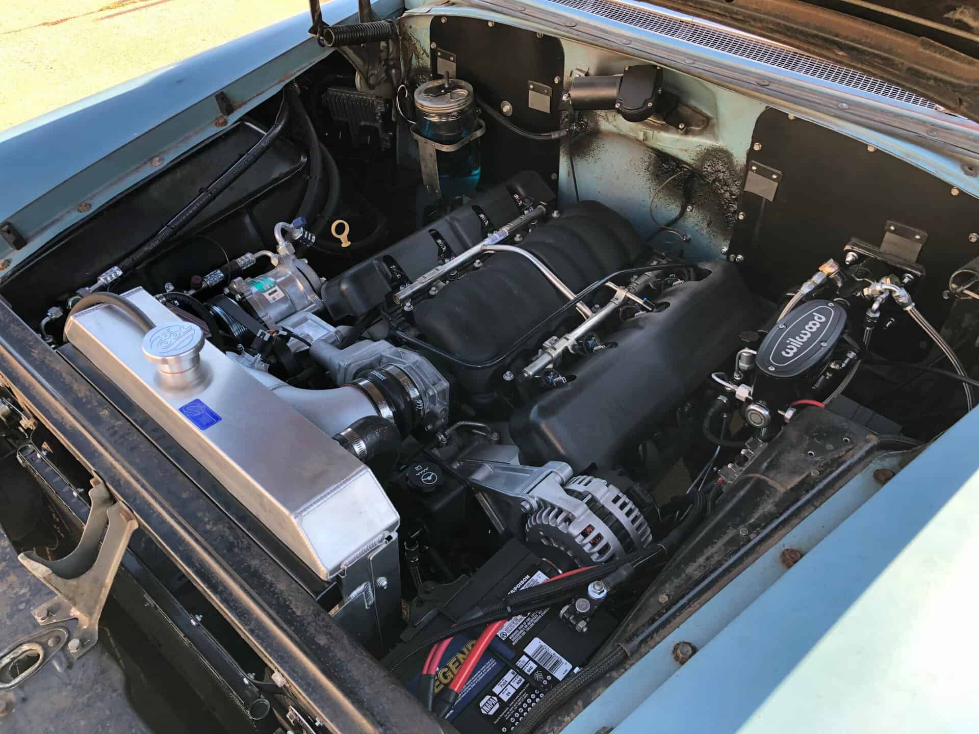 High-performance race car engine with custom modifications and turbocharger from All Speed Customs.