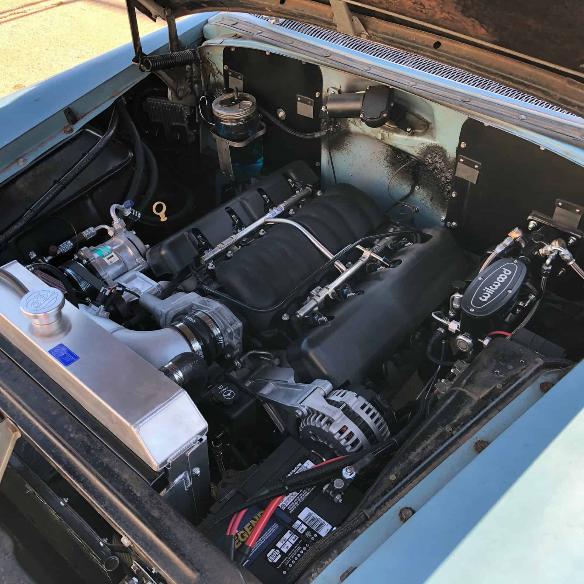 High-performance custom car engine with upgraded components by All Speed Customs.
