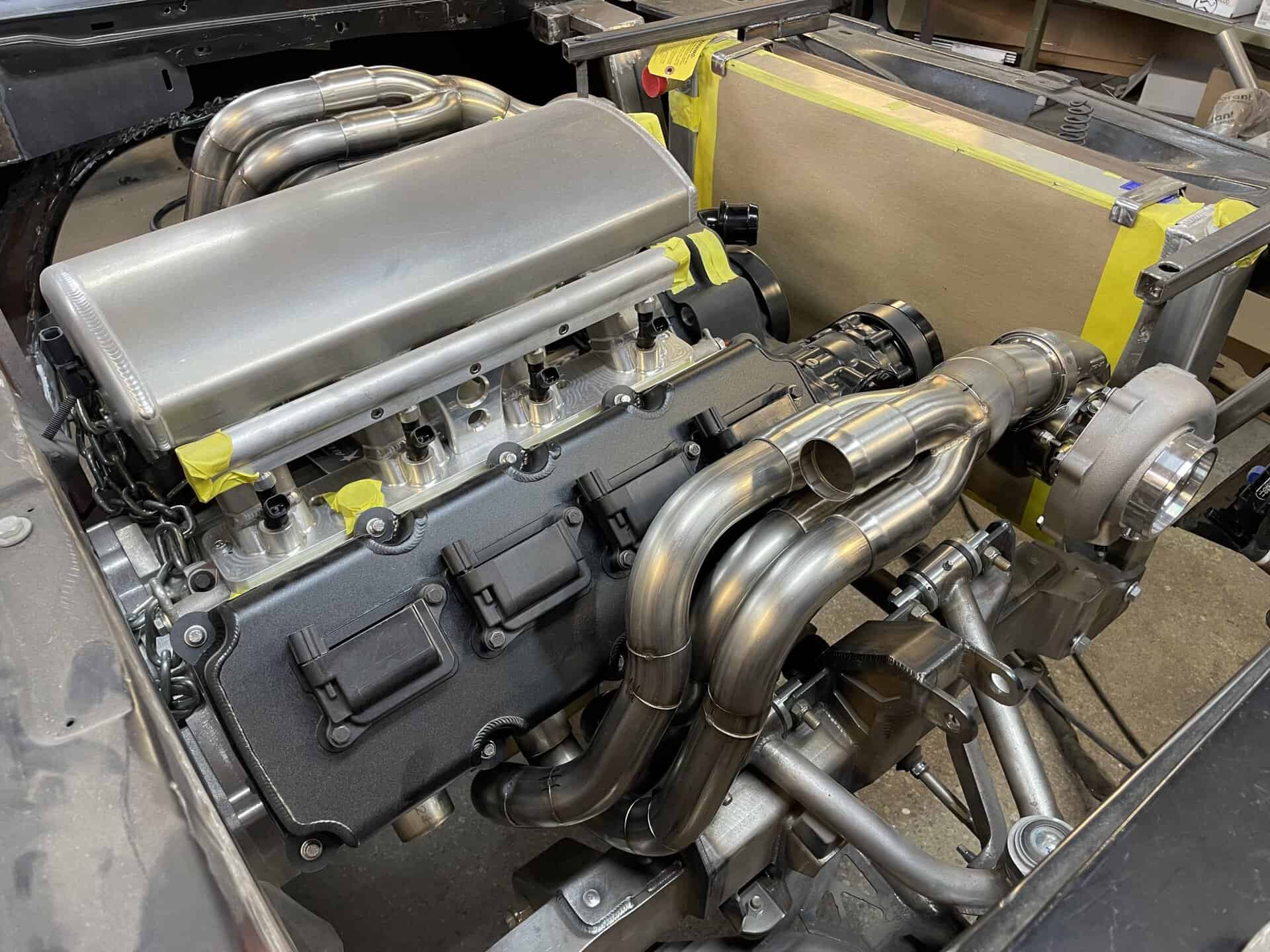 Custom built engine with polished exhaust headers and intake manifold for 1968 Dodge Charger.