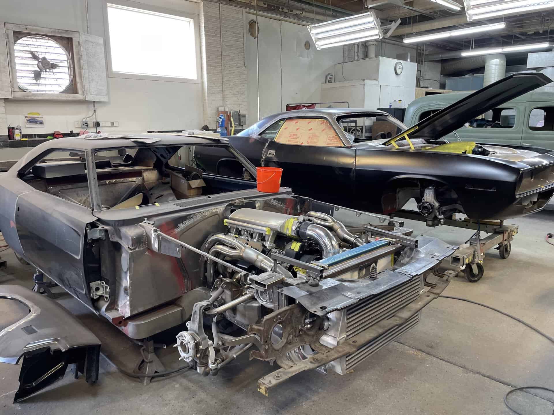 Restoring a classic 1968 Dodge Charger in a workshop setting.