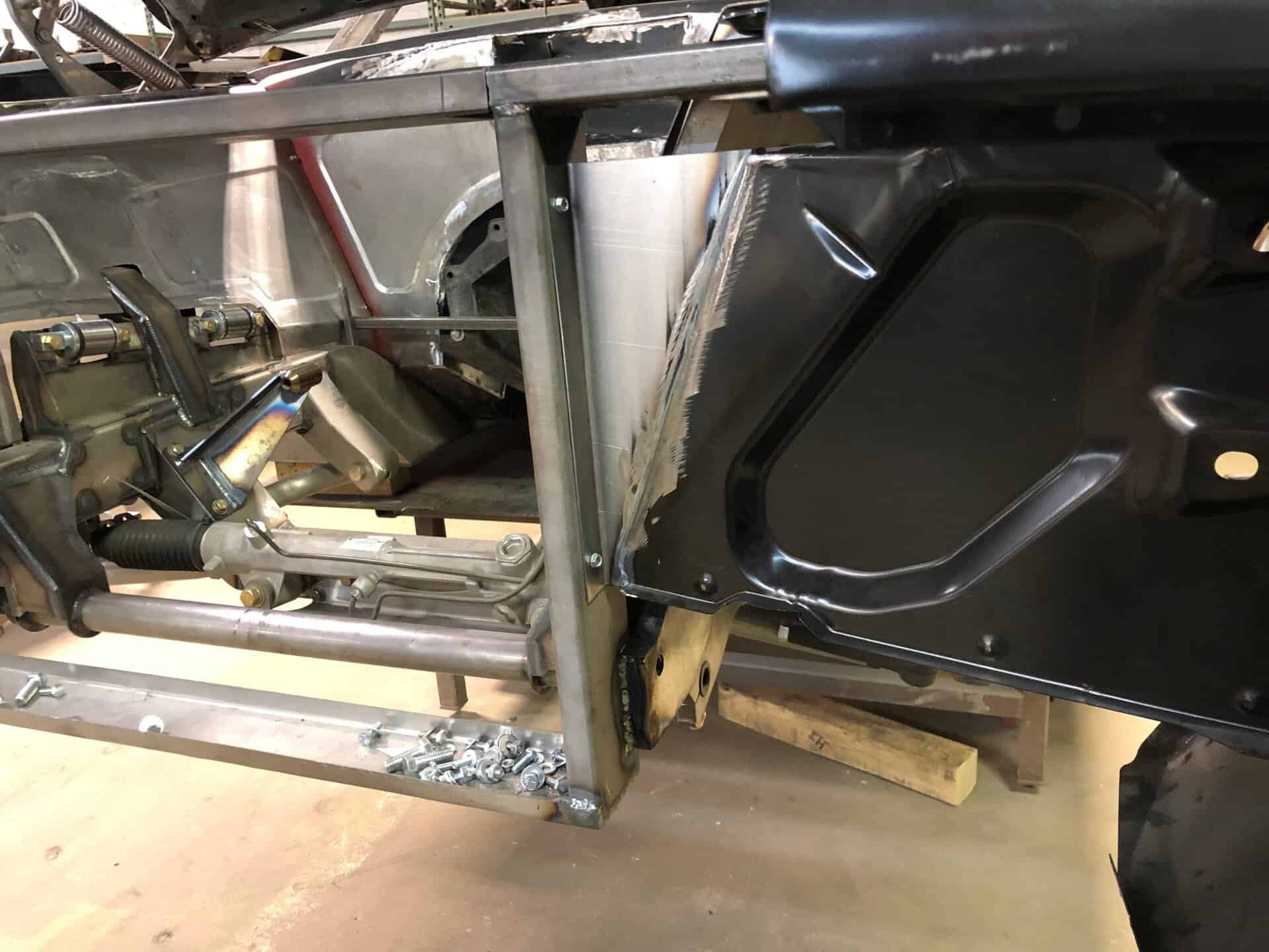 Close-up of custom metal frame and suspension components of a 1968 Dodge Charger.