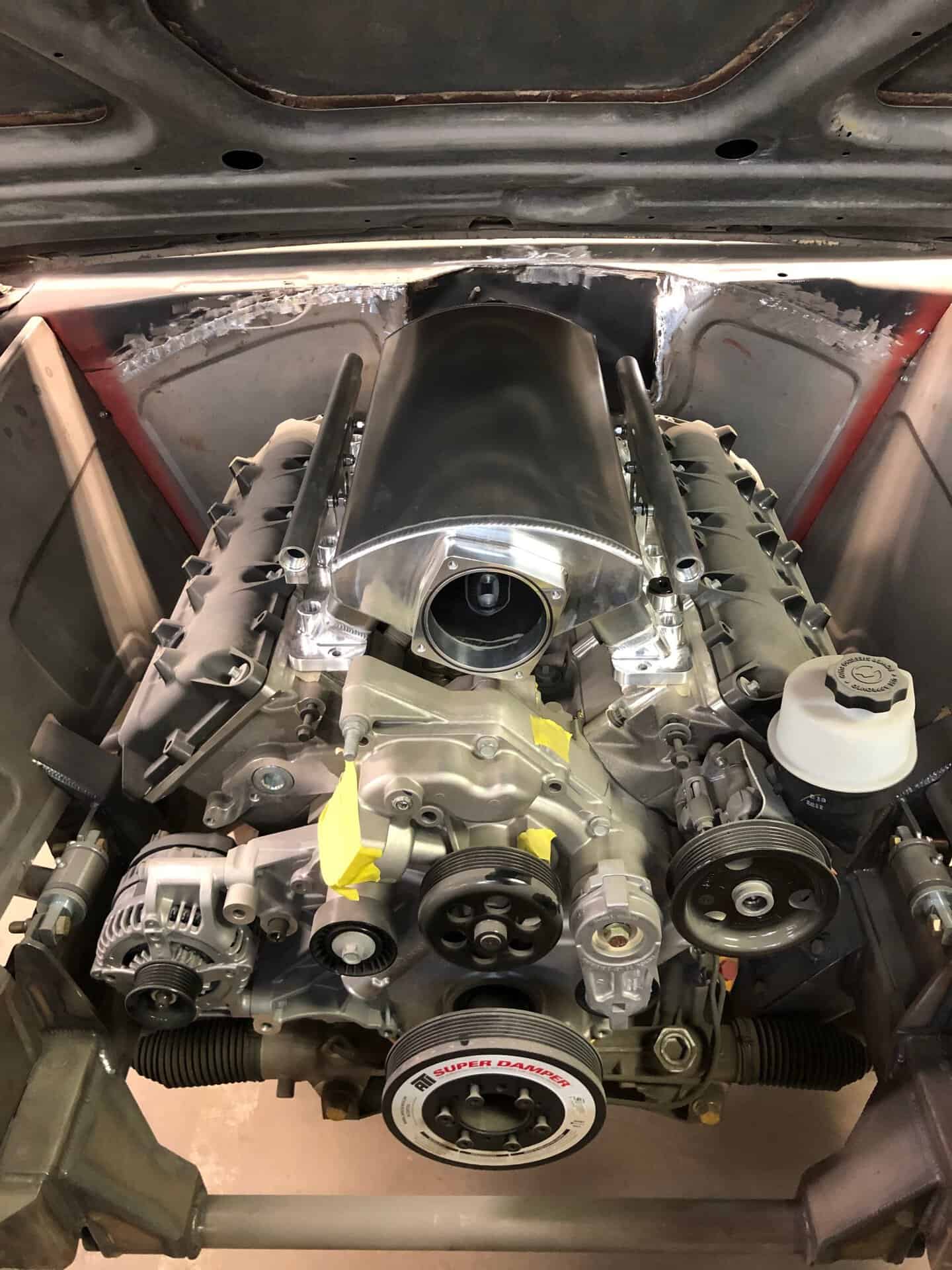 V8 engine installed in a classic 1968 Dodge Charger with custom modifications.