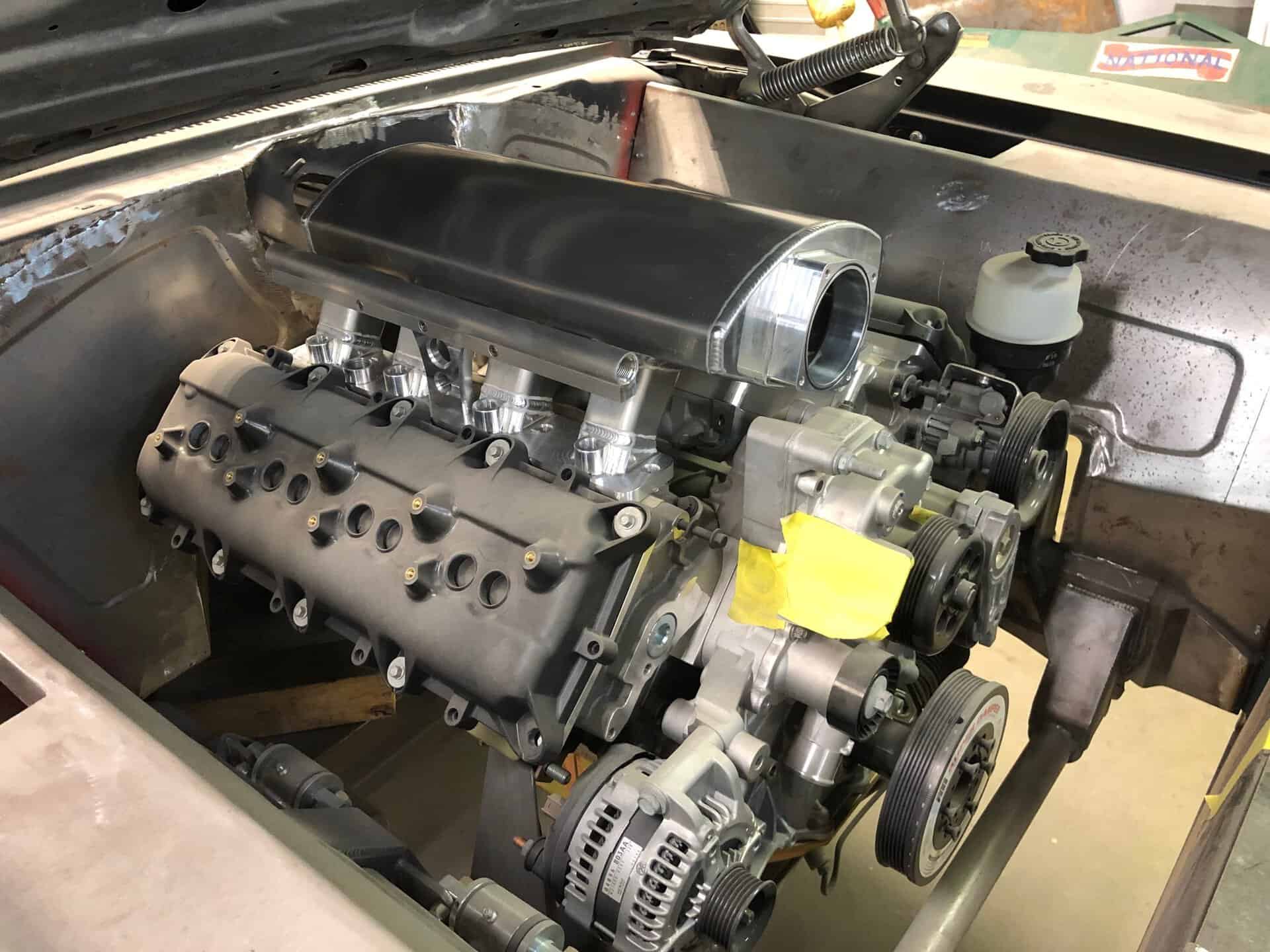 V8 engine installed in a classic 1968 Dodge Charger with custom modifications.