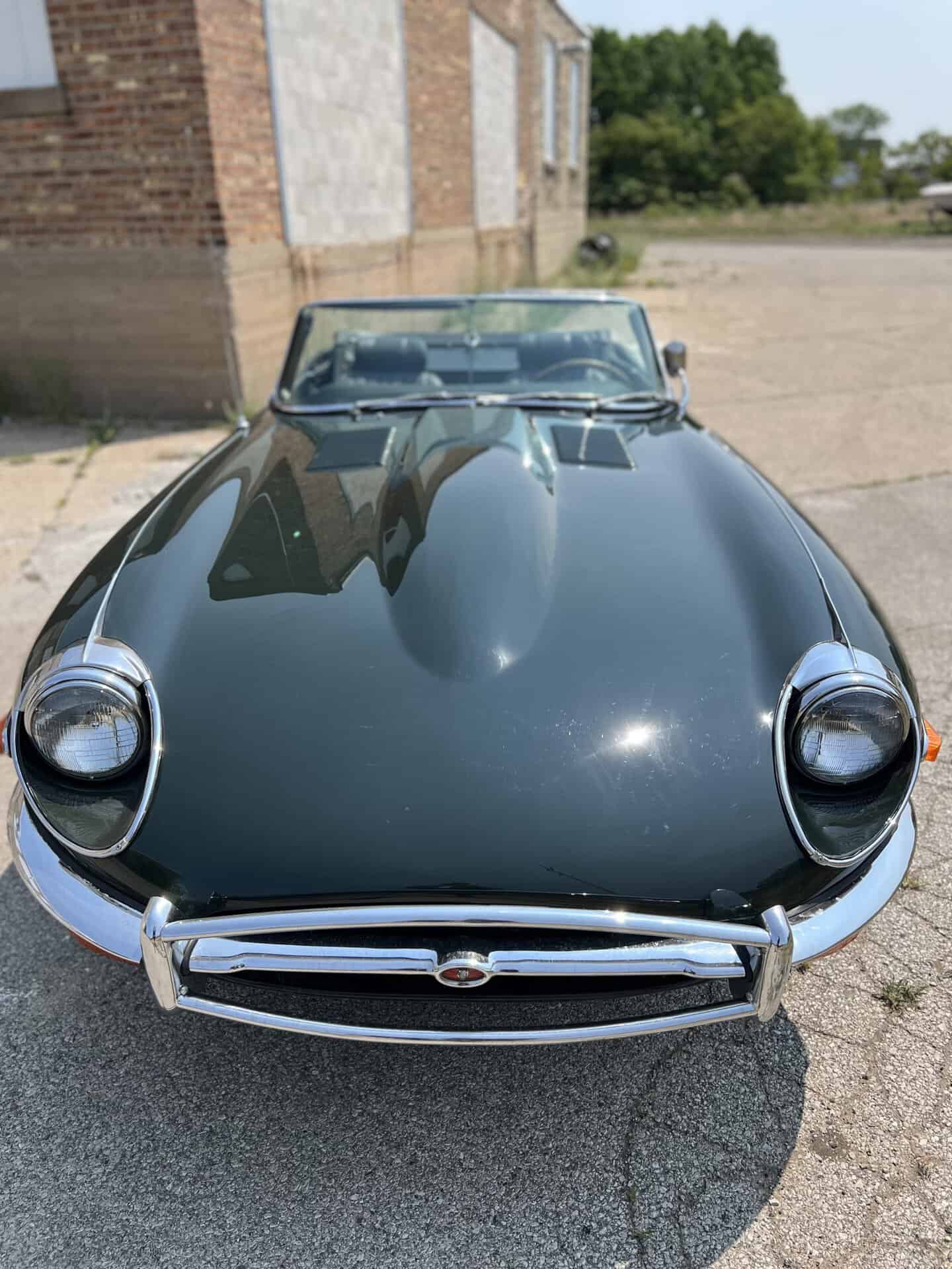 Black 1970 Jaguar E-Type convertible with chrome details.