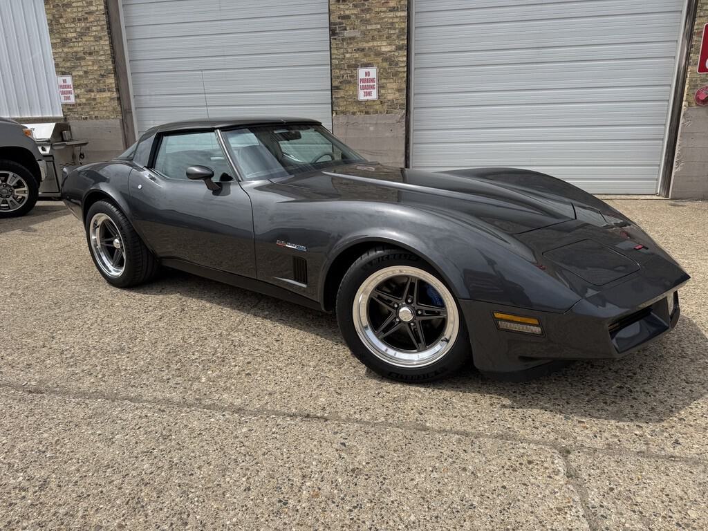Black 1981 Chevrolet Corvette with custom wheels and sleek design.