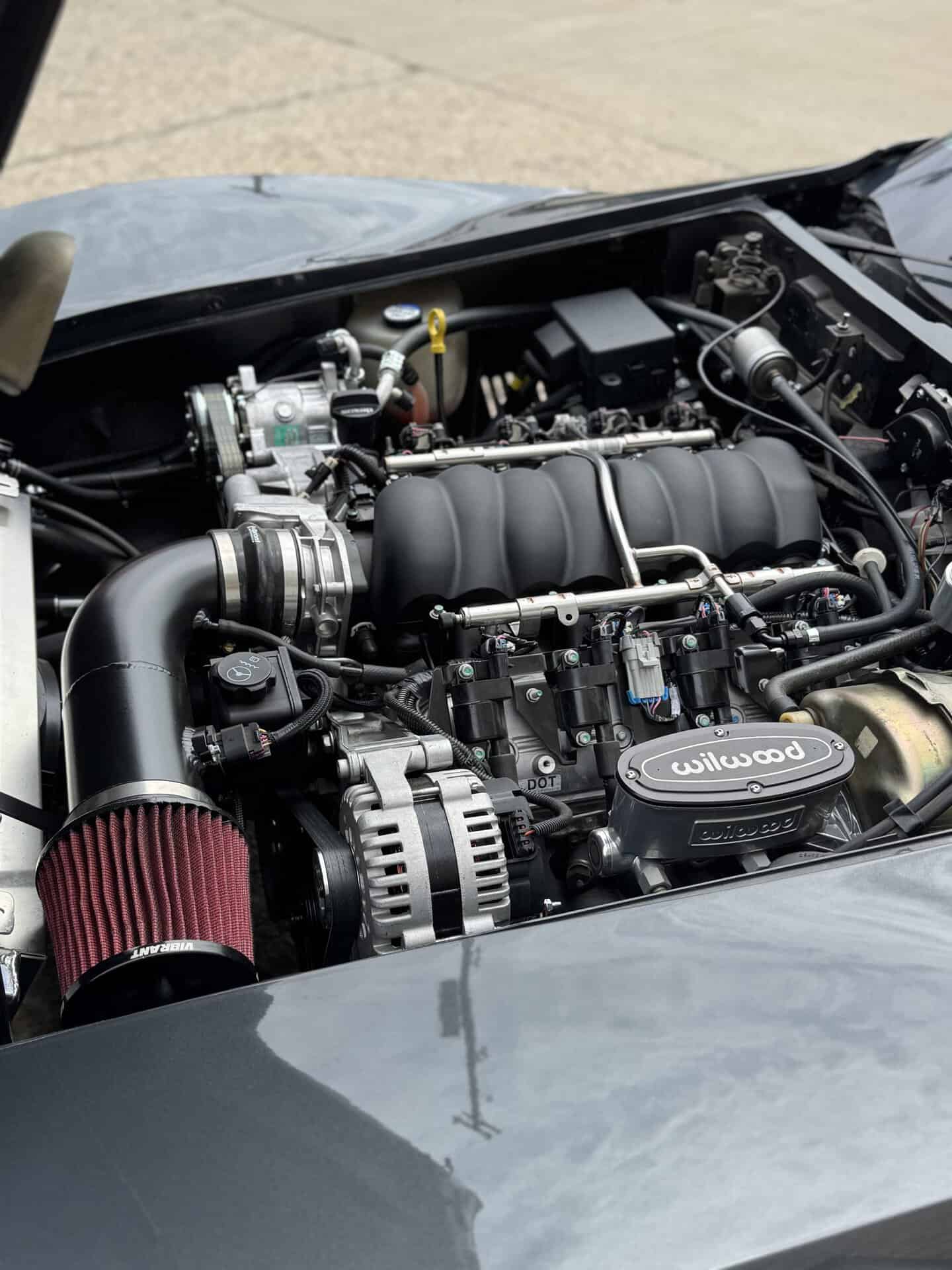 Detailed view of a Chevrolet Corvette engine with aftermarket parts.