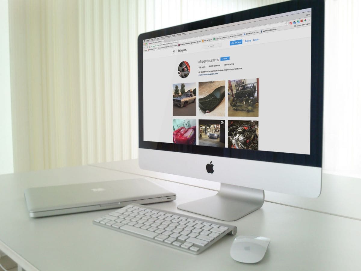 IMac displaying All Season Innovations Instagram page with various vehicle images.