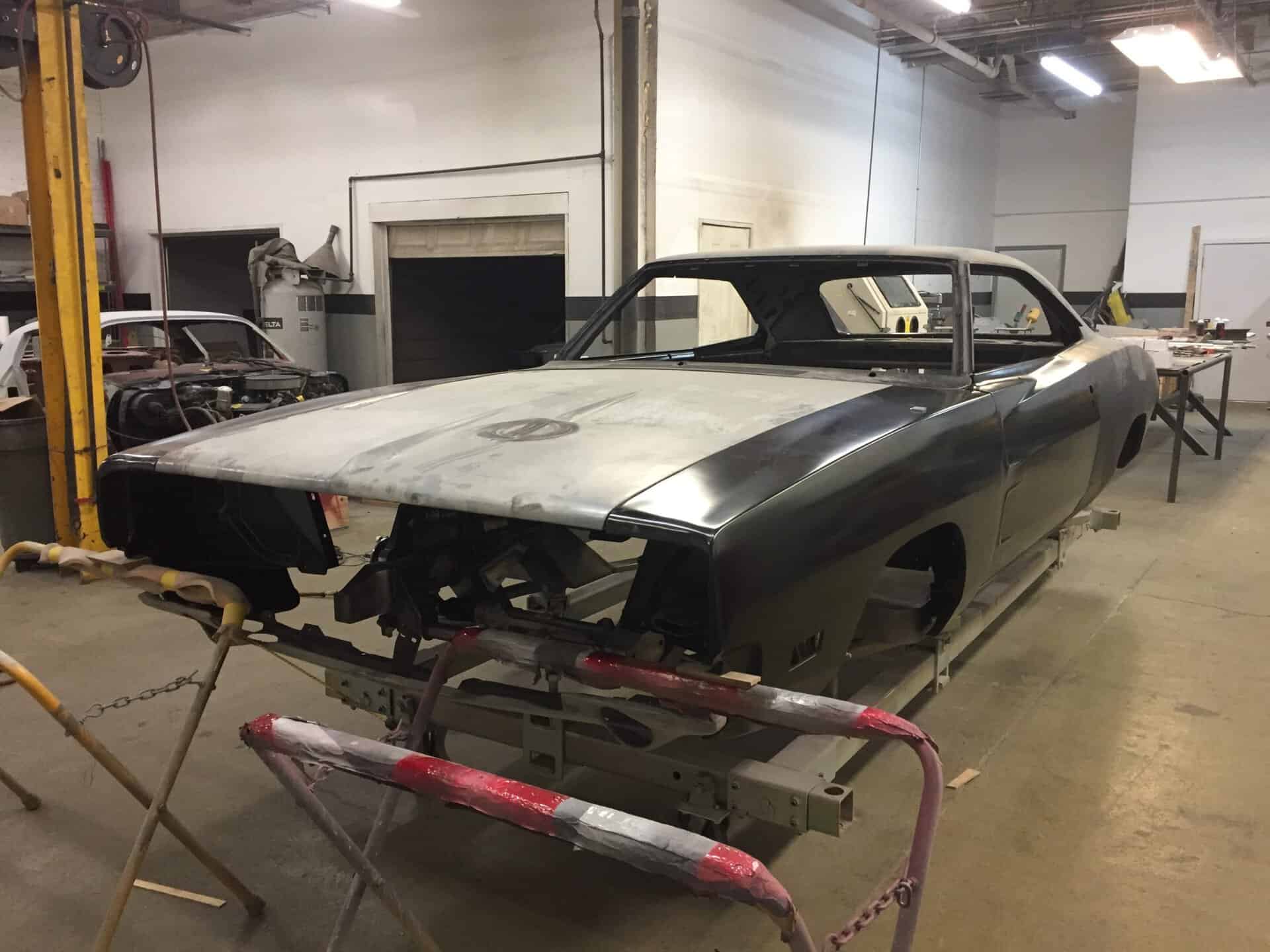 Restoring a 1968 Dodge Charger in a workshop setting.