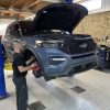 High-performance car repair and customization by All Speed Customs in a professional auto shop.