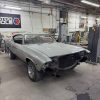 Vintage car in restoration process at All Speed Customs workshop.