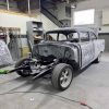 Restoring a vintage car at All Speed Customs workshop.