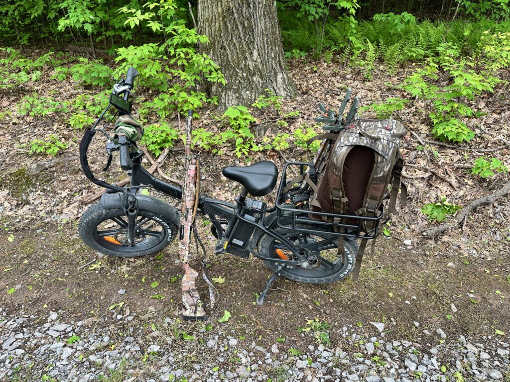 My Rattan e-Bike with my hunting gear on it while turkey hunting this spring.