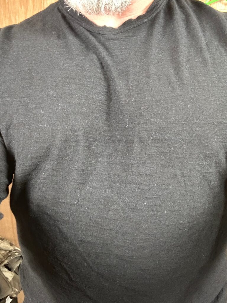 Close up of how the texture of the Arms of Andes Alpaca base layer top looks when worn.