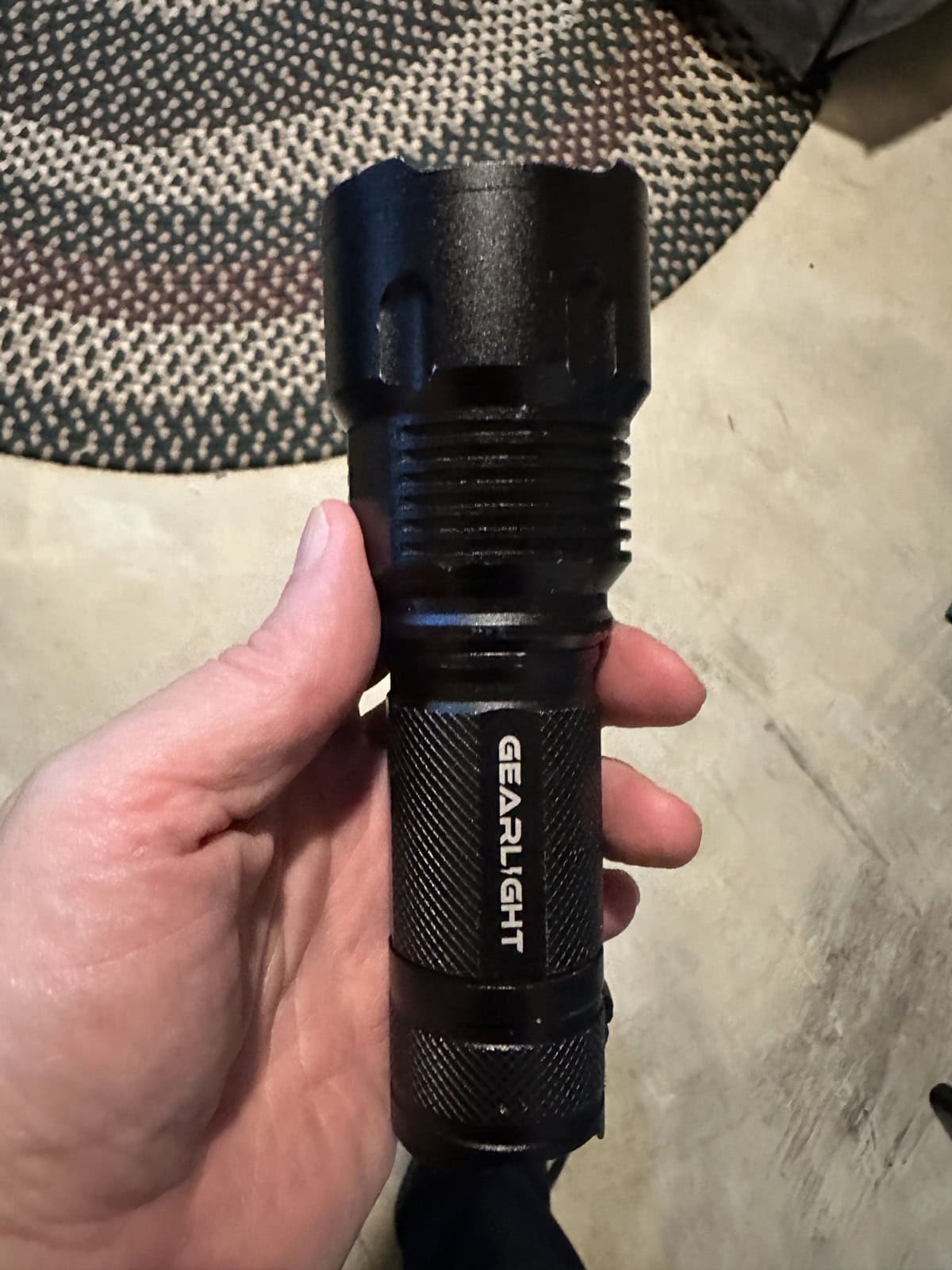 GearLight handheld flashlight with adjustable spot-to-flood head