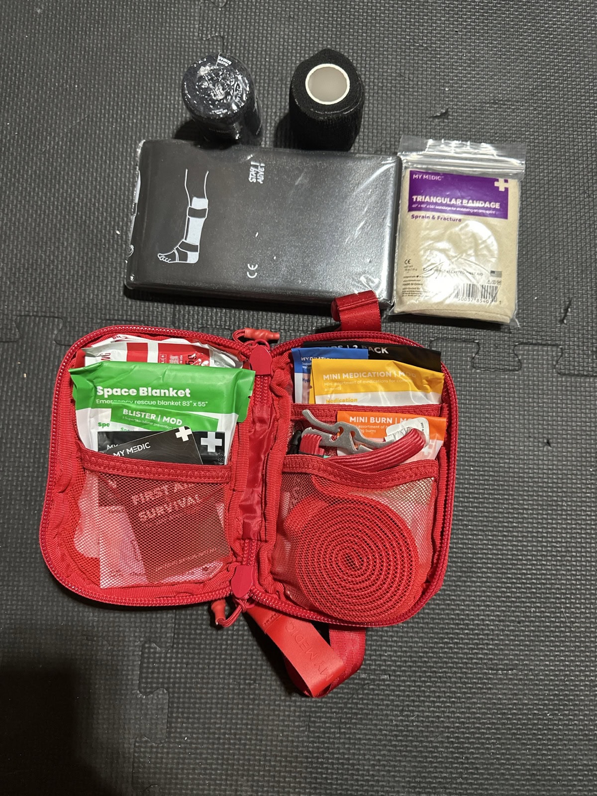 MyMedic Sidekick with splint, gauze, wraps, and triangular bandage