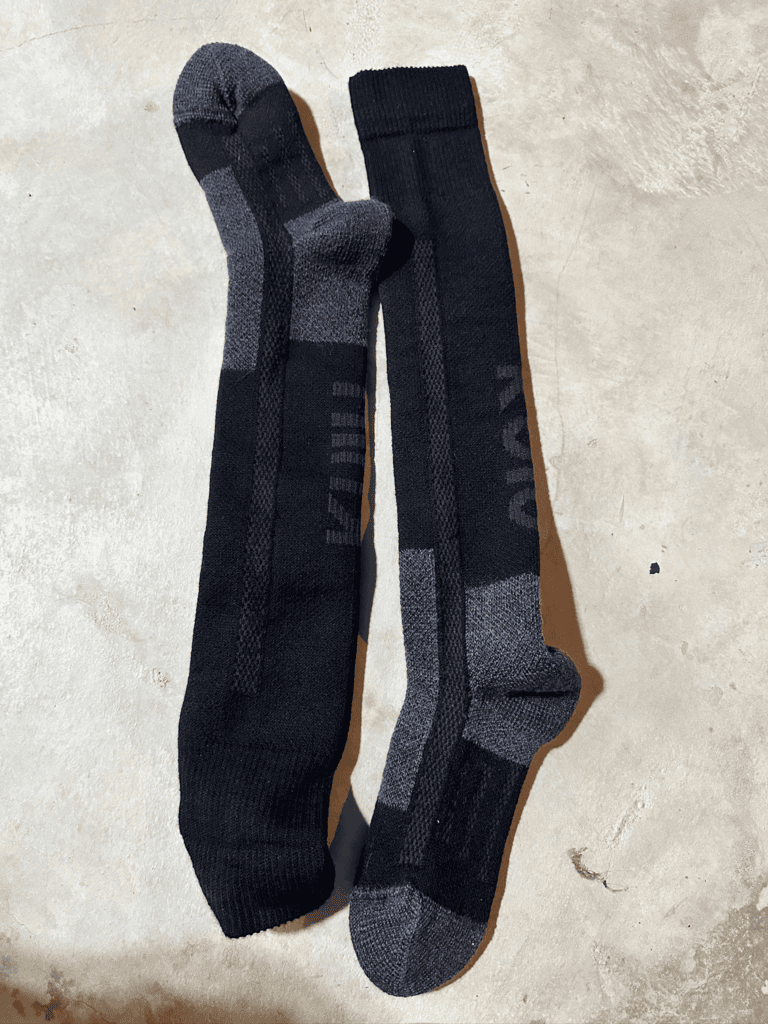 Mike's KUIU StrongWool Heavyweight hunting socks laid out for comparison