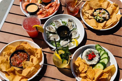 Outdoor rooftop dining with fresh seafood and drinks at Attwood's Kitchen & Drink. Enjoy a relaxing.