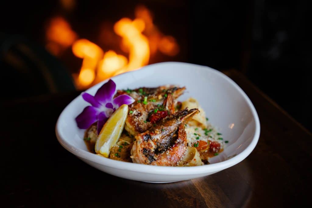Delicious grilled fish served with lemon and herbs at Attwood's Kitchen & Drink.
