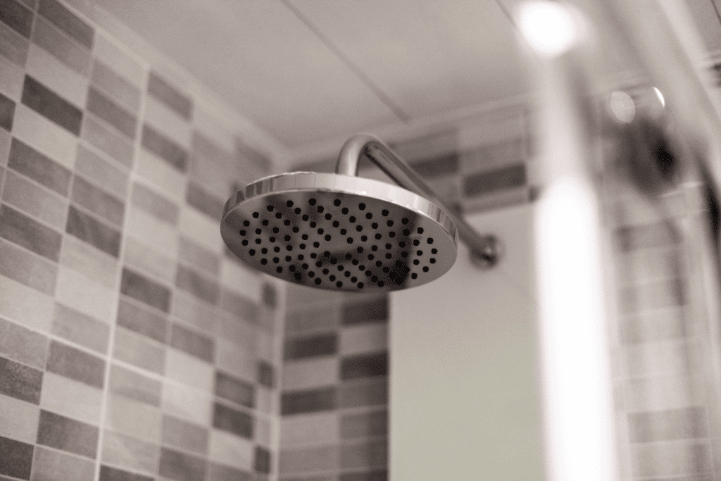 Shower running warm water, the best time to exfoliate before shaving