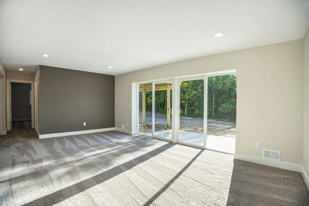 Spacious living room with large sliding glass doors and natural light.
