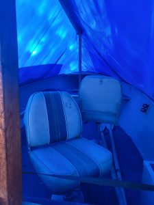 Boat interior with blue lighting and seating in Alumacraft Lunker 14 used boat.