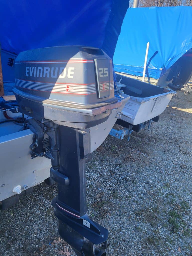 Evinrude 25 HP outboard motor attached to Alumacraft boat.