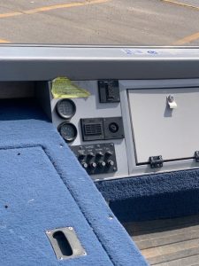 Boat control panel with switches and gauges on a Lund 1650 Angler.