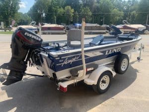 Used 1996 LUND 1650 Angler fishing boat on trailer.