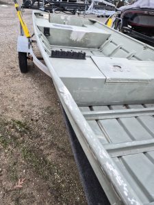 Durable gray boat for fishing and water sports at Camp & Cruise.