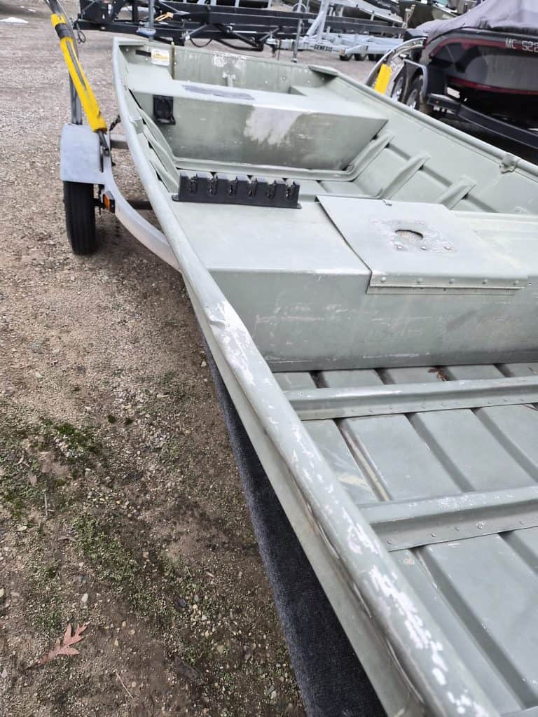 Durable gray boat for fishing and water sports at Camp & Cruise.