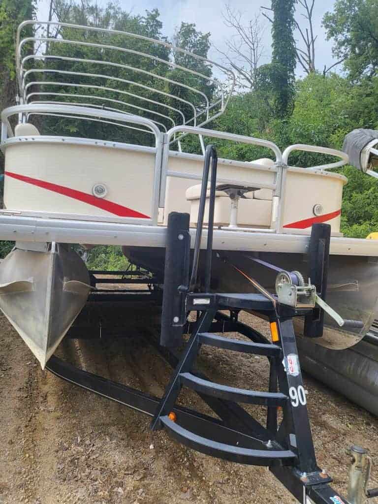 Used 2010 Sweetwater 23 Fish pontoon boat with seating and trailer.