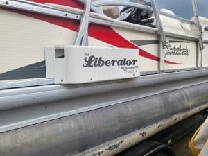 Sweetwater 23 Fish pontoon boat with The Liberator by Jackson on the side.