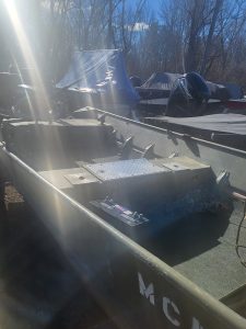 Used Lowe 15' 10 jon boat with outboard motor and accessories.