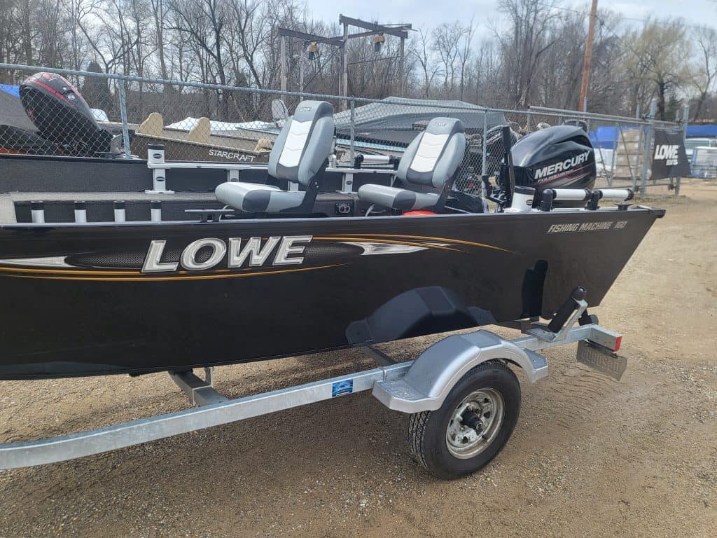 Used Lowe FM160 boat with Mercury outboard motor on trailer.