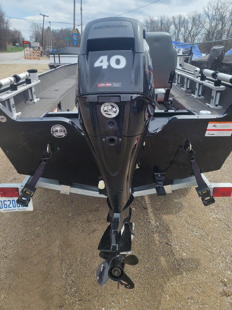 Mercury 40 HP outboard motor on boat for sale.