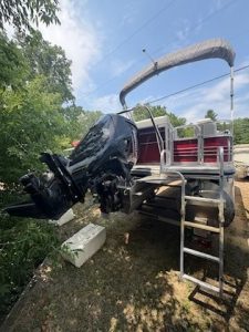 Used Lowe Boats SS210 pontoon boat with outboard motor and canopy.