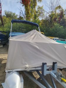 Boat cover displayed at Camp & Cruise, ideal for boat protection and storage.
