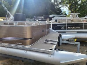 Image of pontoon boats on display, ready for water adventures at Camp & Cruise.