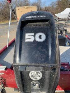 Mercury 50 horsepower outboard motor on a boat for sale.