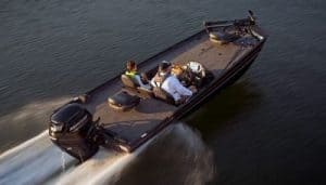 Powerful boat with Mercury 90 Hp engine cruising on water.