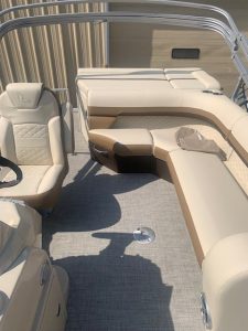 Interior view of Lowe Boats SS210 with beige seating and aluminum railing.