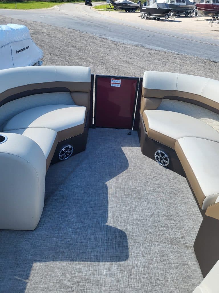 Boat interior with curved seating and speakers, Lowe SS210 2022 model.