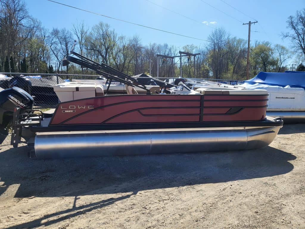 Lowe SS210 pontoon boat with red and black design on a trailer.