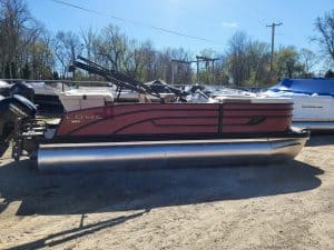 Lowe SS210 pontoon boat with red and black design on a trailer.