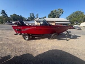 Red Lund boat on trailer available for purchase.