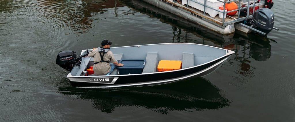 Lowe Boats 1470 fishing boat with outboard motor on water.