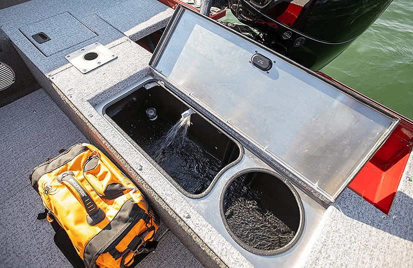 Boat storage compartment with water fill and fishing gear on Lowe Boats FM1800.